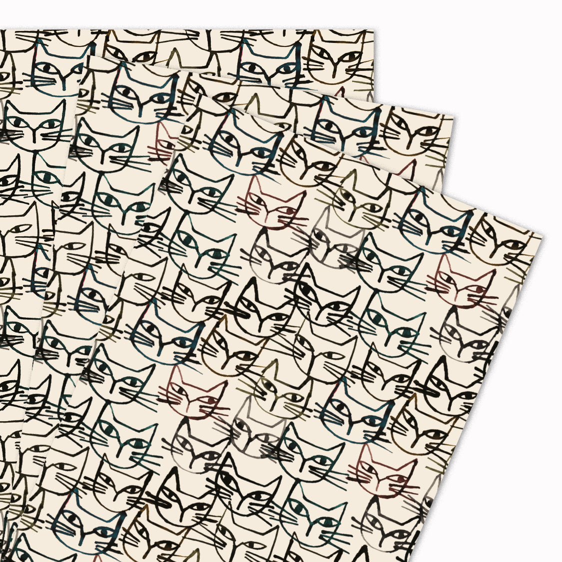 Pack of 3 'Inky Felines' gift wrap sheets illustrated by Clare Owen for USTUDIO Design. This design features the artist's inky black pen lines with sketches of a cat face. Beautifully monochrome and stylish, this gift wrap is perfect for cat lovers.