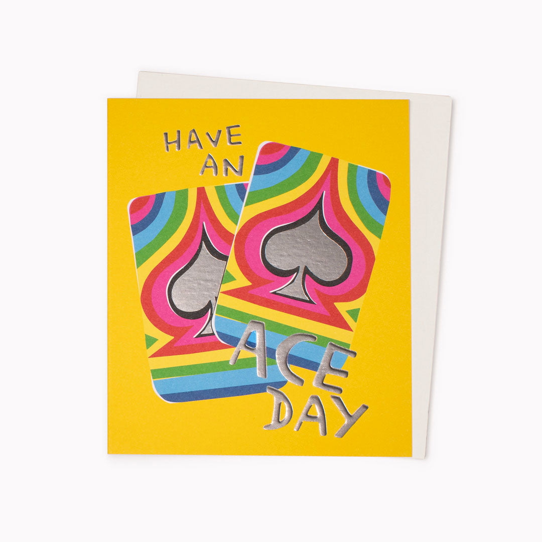 Have An Ace Day Greeting Card is a rainbow bright, playing card themed note card featuring artwork by artist and screen printer, David Newton.