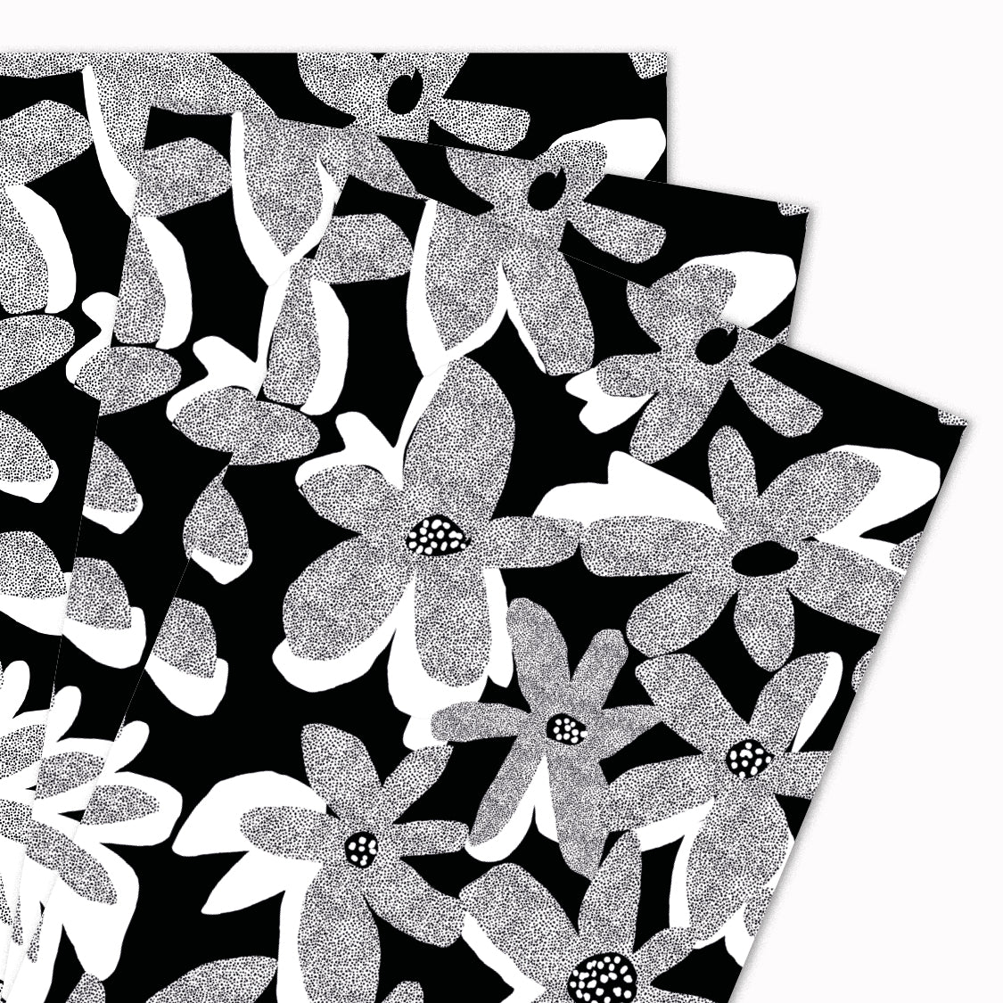 Pack of 3 'Dark Bloom' gift wrap sheets illustrated by Katy Welsh for USTUDIO Design. A beautiful, bold floral design in a monochrome colour palette, featuring graphic textured flowers on a black background.