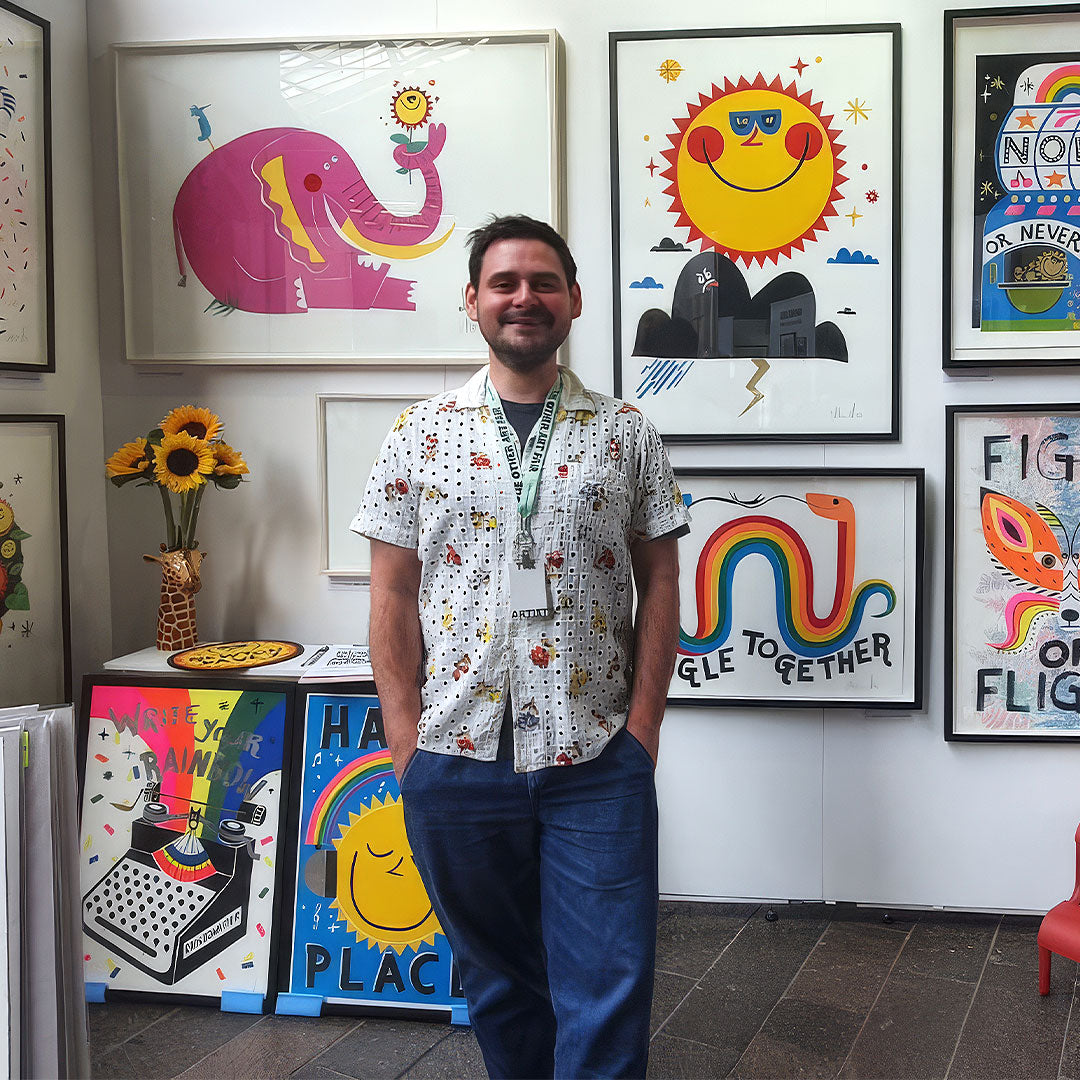 Portrait of Illustrator and screenprinter David Newton aka Newton Davey standing in front of his work.