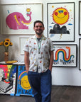 Portrait of Illustrator and screenprinter David Newton aka Newton Davey standing in front of his work.