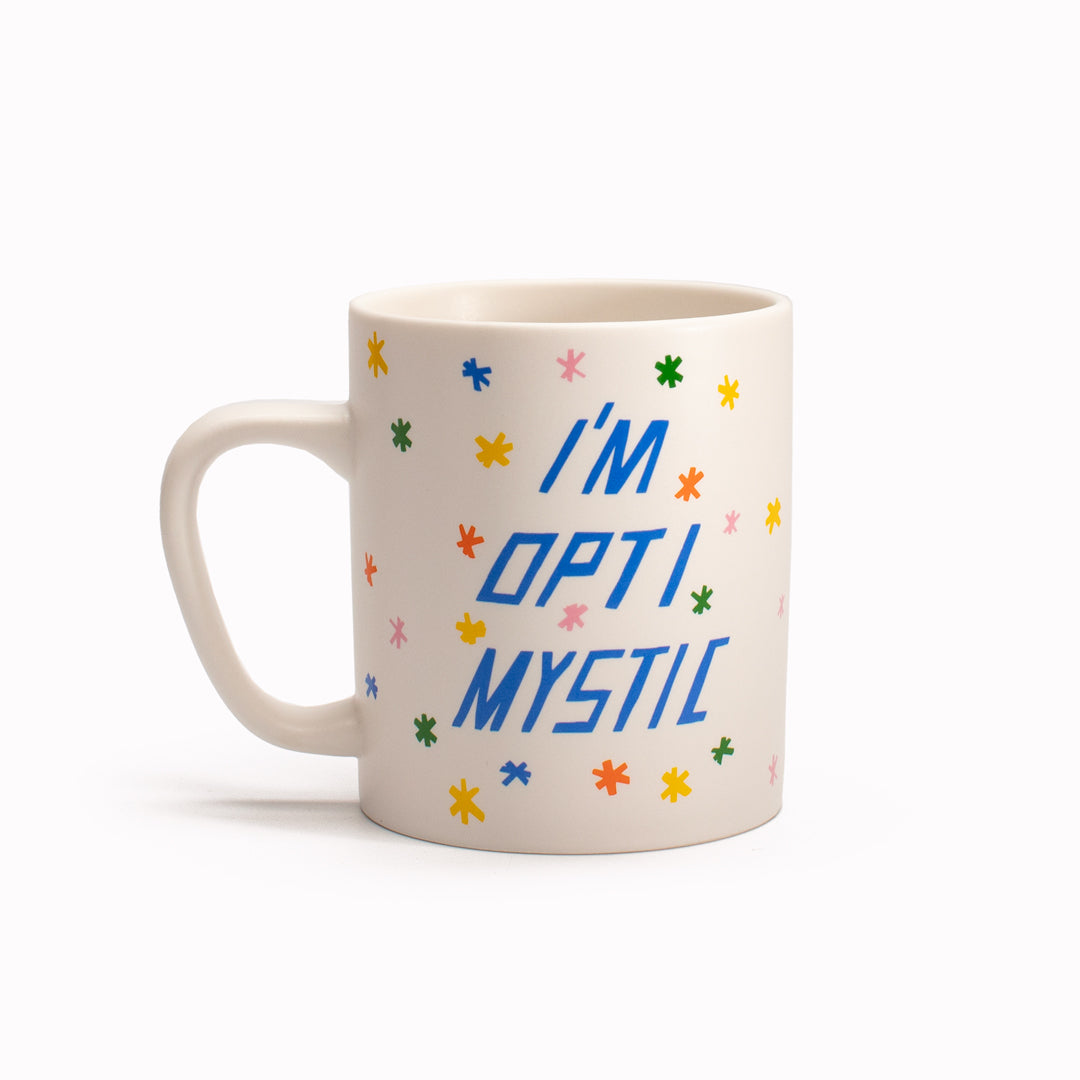 &#39;Optimistic&#39; stoneware mug by artist Scott Patt for USTUDIO Design. A cheery and bright message surrounded with colourful doodled stars for a daily reminder to remain positive.