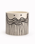 'Beardy Samuel' is a white plant pot with a great marker pen cartoon beardy decal face. Made of glazed stoneware so entirely watertight, you can plant a small houseplant inside where the leaves will hang over as 'foliage' hairstyle.