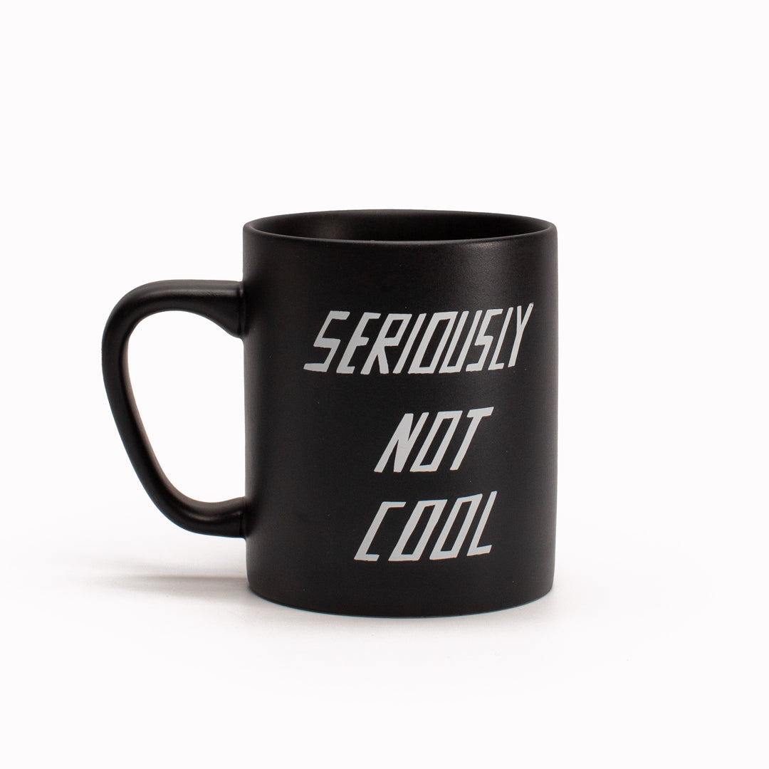 'Seriously Not Cool' stoneware mug by artist Scott Patt for USTUDIO Design. A graphic, monochrome mug with a relatable sardonic statement.