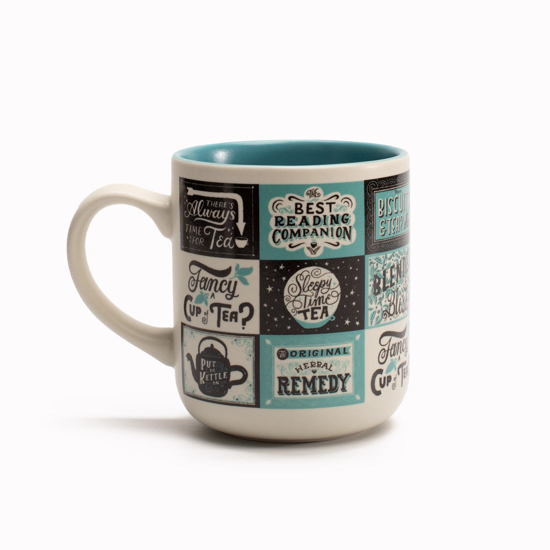 'Tea Lovers' stoneware mug by USTUDIO Design features a collage of typographic artwork by Mary Kate McDevitt, perfect for your brew-loving pals.